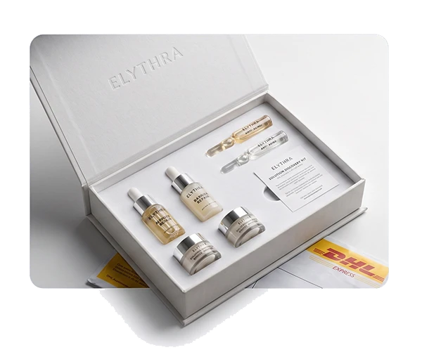 Elythra Skincare Solution Discovery Kit featuring 6 benchmark formulations, including clinical ampoules, serums, and barrier repair creams in a premium white gift box, dispatched via DHL Express.